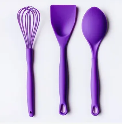 Purple whisk, spatula and spoon
